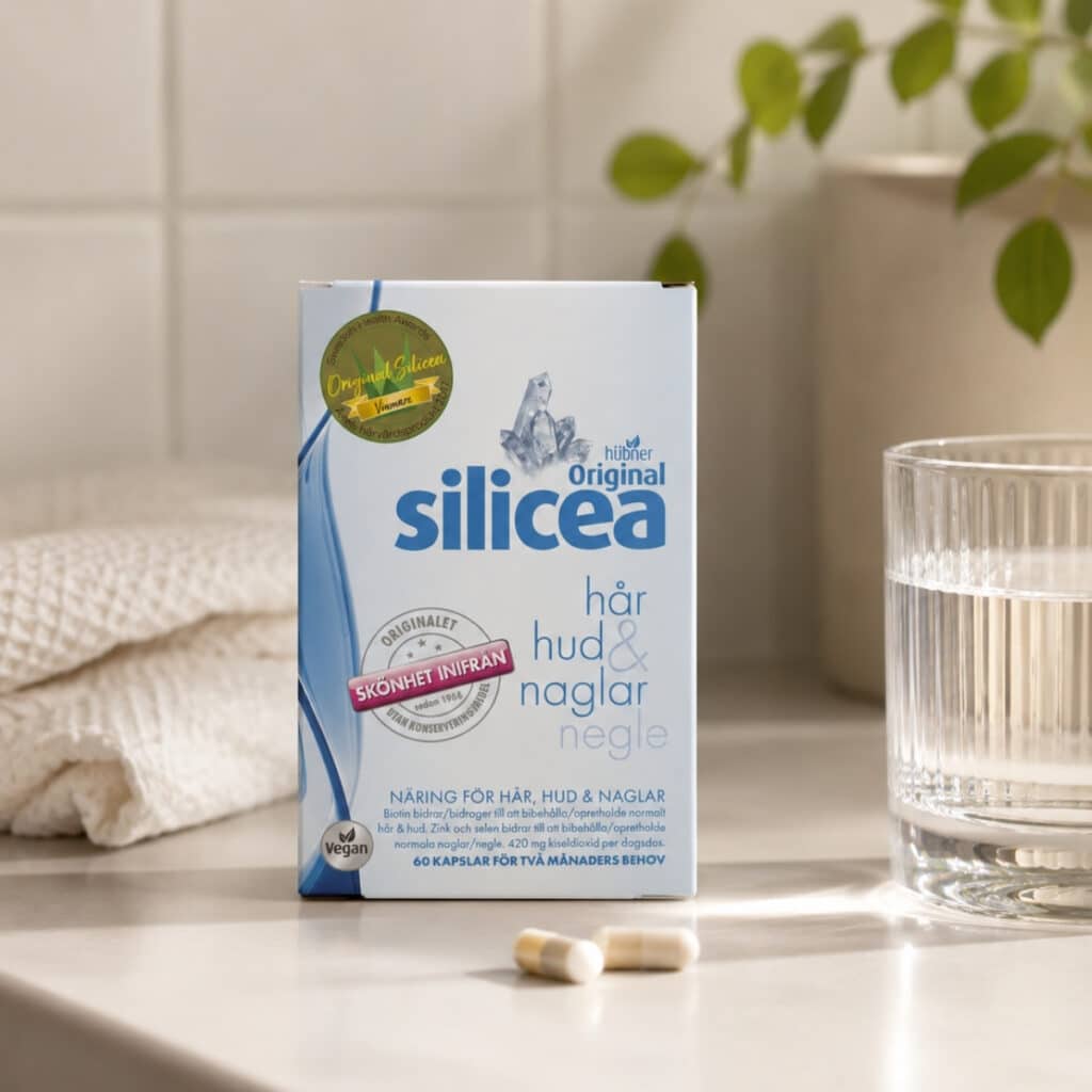 Original Silicea kapslar med kapslar och ett glas vatten